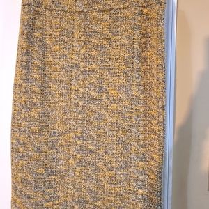 Black, white and golden twead like midi skirt.